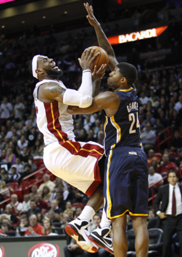 LeBron James collides with Paul George 