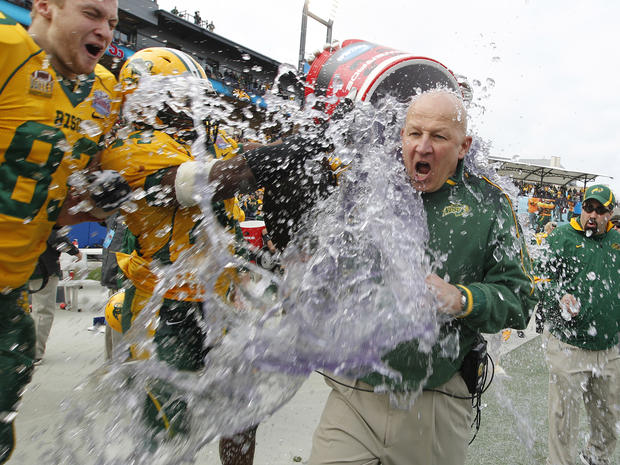 North Dakota State head coach Craig Bohl is doused with water 