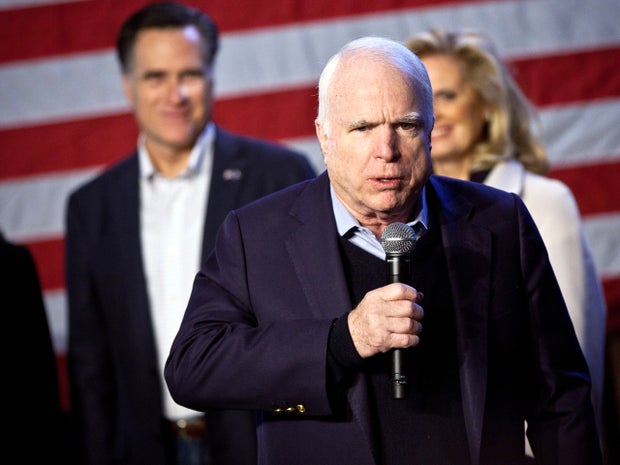 Sen. John McCain, R-Ariz., speaks during a campaign event for former Massachusetts Gov. Mitt Romney as Romney and his wife Ann Romney listen at the Peanut Warehouse Jan. 6, 2012, in Conway, S.C. 