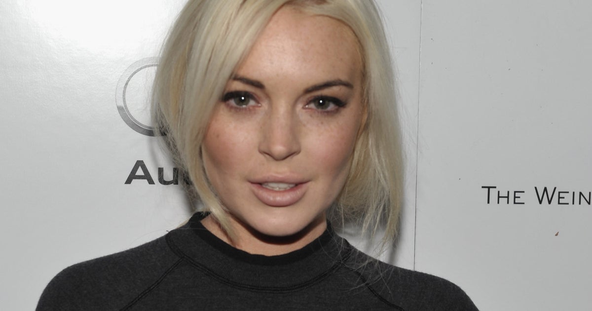 Lindsay Lohan pokes fun at legal troubles in "SNL" promos CBS News