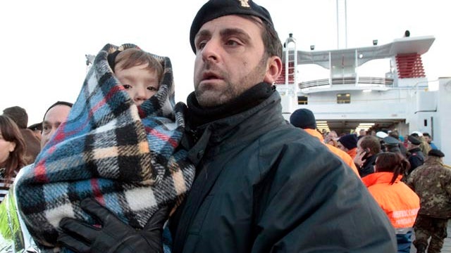 The luxury cruise ship Costa Concordia leans after it ran aground off the coast of Isola del Giglio island, Italy, gashing open the hull and forcing some 4,200 people aboard to evacuate aboard lifeboats to the nearby Isola del Giglio island, early Saturda 