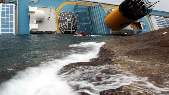 Italian rescue divers approach the Costa Concordia cruise liner two days after it ran aground off the tiny Tuscan island of Giglio, Italy, Jan. 16, 2012. The captain of the cruise liner faced accusations from authorities and passengers that he abandoned s 