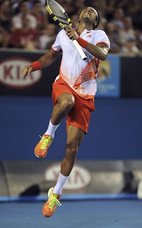 Jo-Wilfried Tsonga celebrates after winning over Denis Istomin 