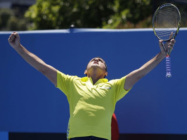 Nicolas Almagro celebrates after defeating Lukasz Kubot 