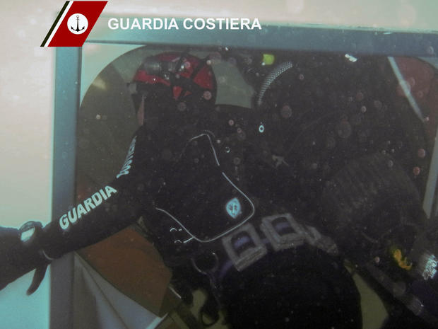 Diver working inside wrecked Costa Concordia 