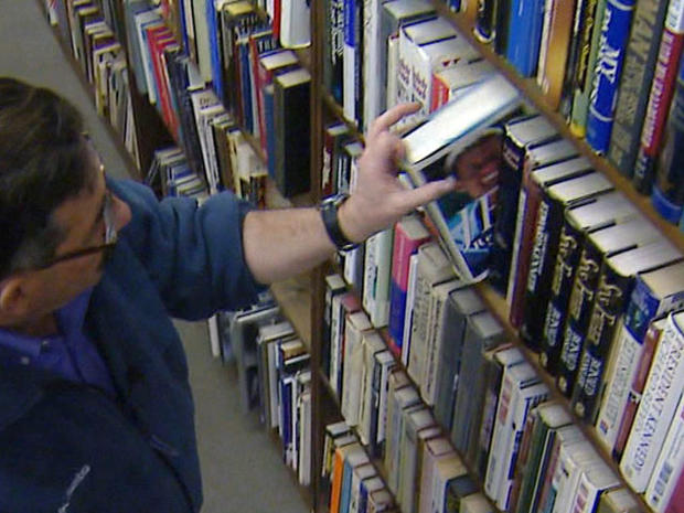 Greg Moody In A Used Bookstore Looking Through Books 