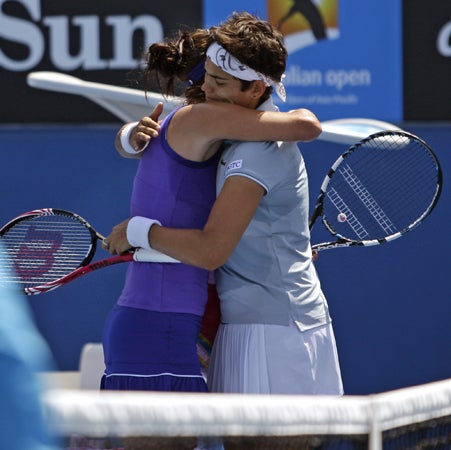 Eleni Daniilidou and Julia Goerges hug each other 