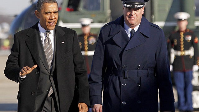President Barack Obama walks toward Air Force One with Air Force Col. Dale S. Holland, vice commander of the 89th Airlift Wing, Jan. 19, 2012, at Andrews Air Force Base, Md.  