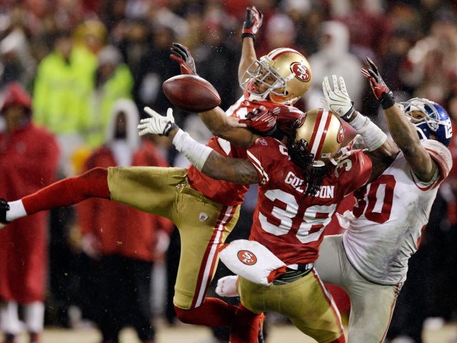 Carlos Rogers break up a pass intended for Victor Cruz  