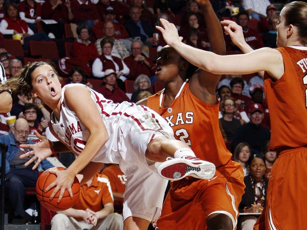 Morgan Hook looks to pass around Ashley Gayle 