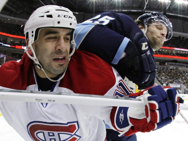 Eric Tangradi  collides with Scott Gomez 