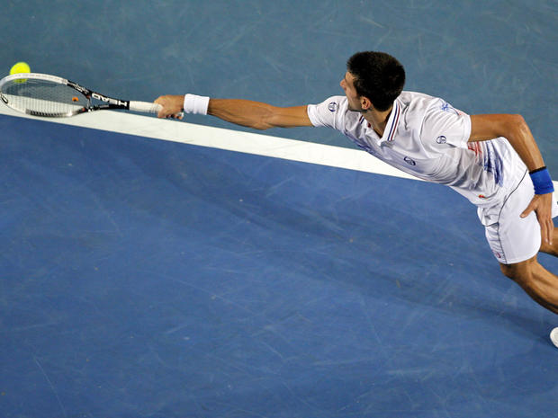 Novak Djokovic stretches out for a return shot to Andy Murray  