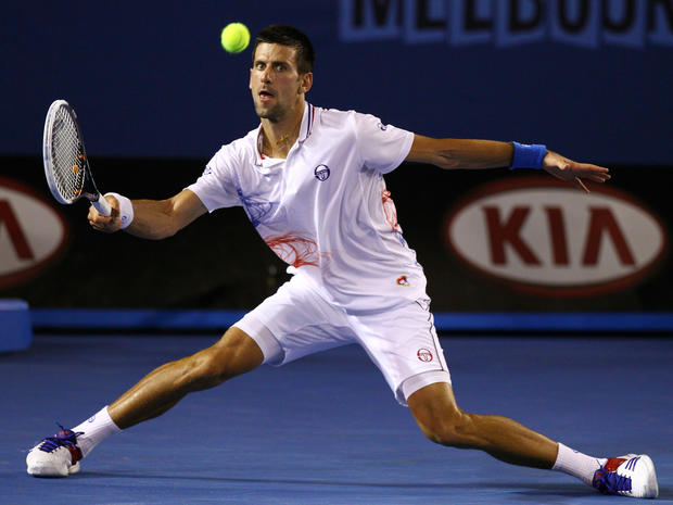 Novak Djokovic plays a shot against Andy Murray  