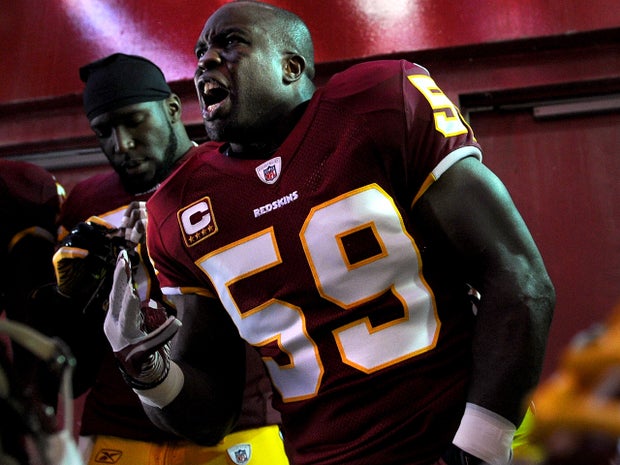 Linebacker London Fletcher (59) of the Washington Redskins pumps up other linebackers before taking on the San Francisco 49ers at FedEx Field Nov. 6, 2011, in Landover, Md.