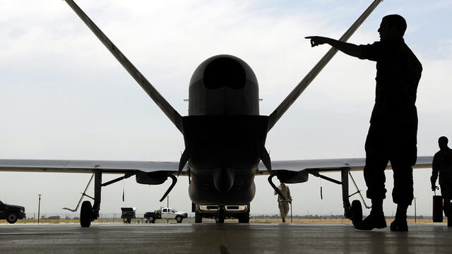 Sr. Airman Nicholas Hart helps guides an RQ-4 Global Hawk Block-20 into its hangar at Beale Air Force Base in Yuba County, Calif., June 30, 2008. 