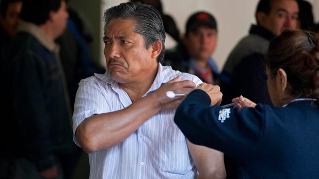 A man gets a voluntary swine flu vaccination from a nurse at a subway station in Mexico City, Tuesday Jan. 31, 2012. Federal Health Secretary Salomon Chertorivski Woldenberg said Tuesday there have been 1,623 cases of all strains of flu in Mexico so far i 