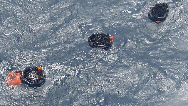 Three life rafts from the MV Rabaul Queen float above the sunken hull of the ferry in the open waters off Papua New Guinea's east coast, Feb. 2, 2012.  