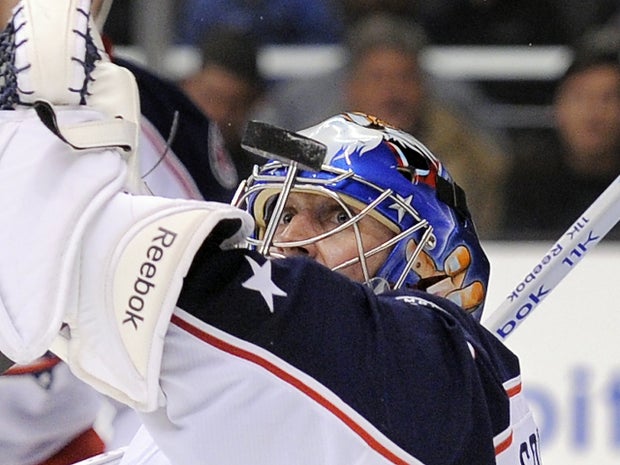 Curtis Sanford stops a shot  