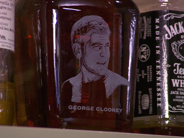 George Clooney's image on a Maker's Mark bottle in his bar 