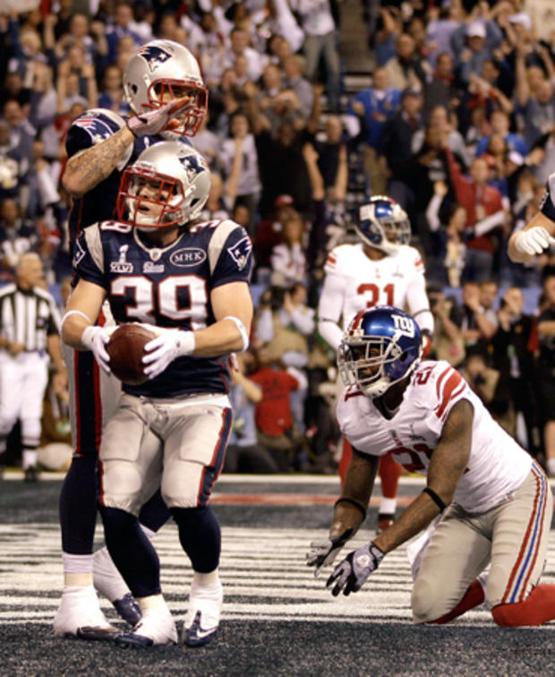 Danny Woodhead celebrates with Aaron Hernandez after scoring a touchdown  