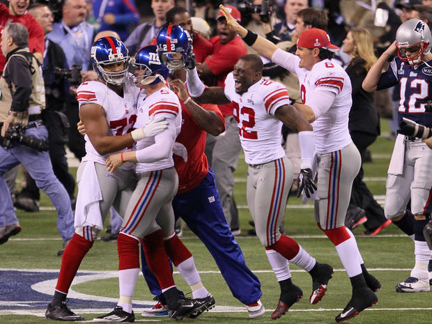 New York Giants celebrate in front of Tom Brady  