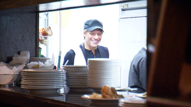 Jon Bon Jovi wahes dishes in his restaurant, "The South Kitchen," in Red Bank, N.J.  