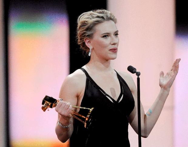 Actress Scarlett Johansson holds her trophy for Best International Actress during the 47th Golden Camera awards ceremony in Berlin, Feb. 4, 2012. 