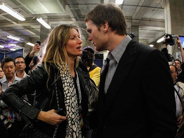 Tom Brady chats with his wife Gisele Bundchen 