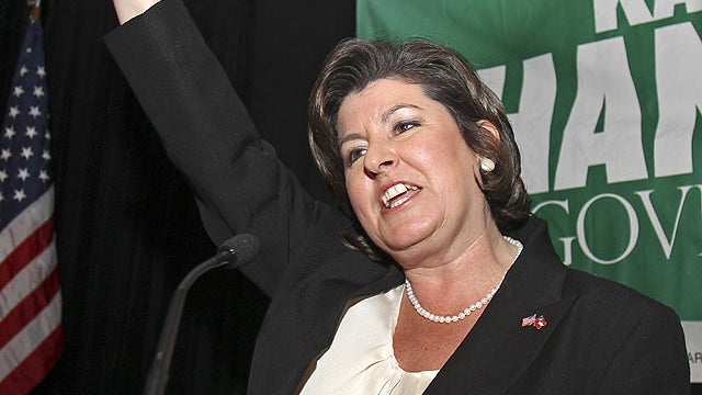 In a Tuesday Aug. 10 2010 file photo, Georgia gubernatorial candidate Karen Handel waves to supporters during an election-night party in Atlanta in her runoff with former Congressman Nathan Deal for the Republican nomination.  