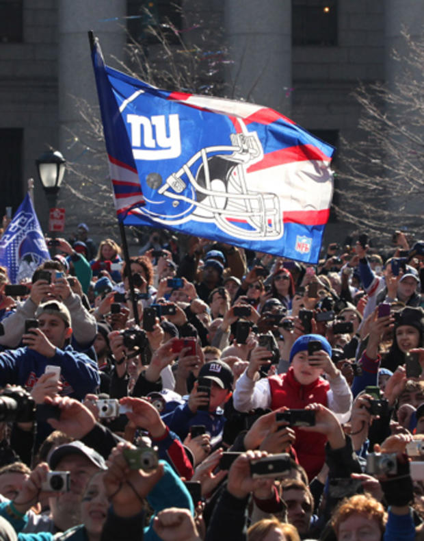 A person waves a flag during the Giants' Victory Parade 