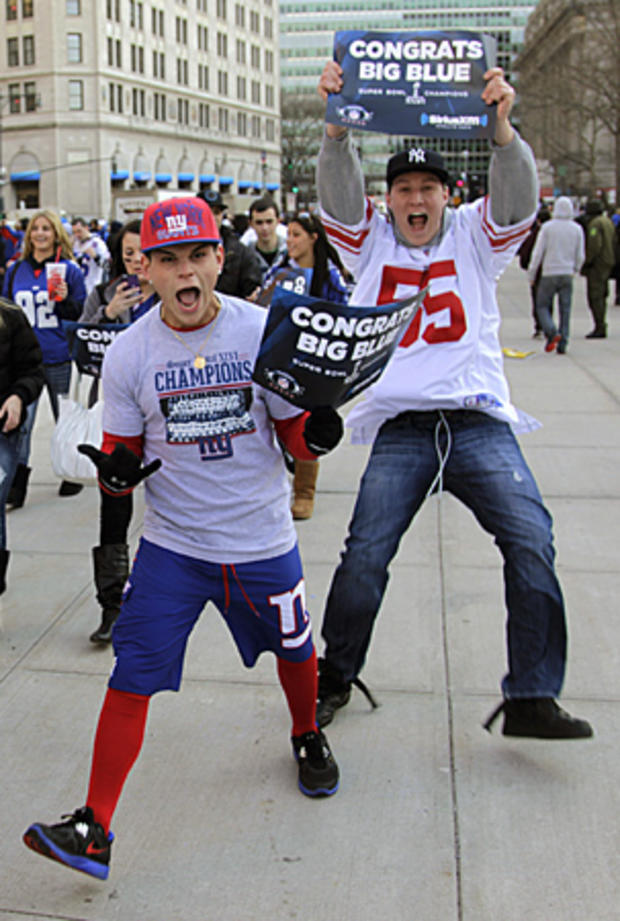 Fans cheer as they arrive in lower Manhattan for the start of the New York Giants Super Bowl parade  