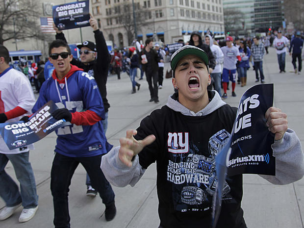 Fans cheer as they arrive in lower Manhattan for the start of the New York Giants Super Bowl parade 