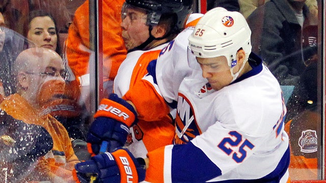  Erik Gustafsson is checked into the boards by Nino Niederreiter 