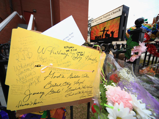 Flower and notes in remembrance of singer Whitney Houston are seen outside The New Hope Baptist Church on Feb. 12, 2012. 
