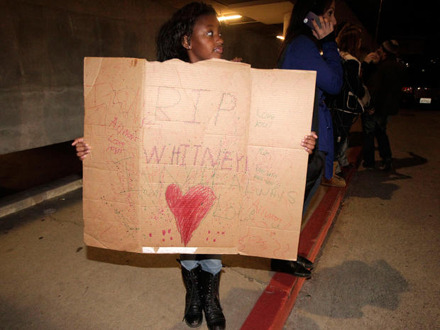 Annika Sillemon, 8, fan of Whitney Houston, is seen outside the Beverly Hilton Hotel Saturday Feb. 11, 2012 
