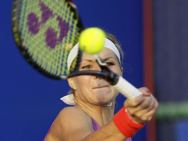 Maria Kirilenko returns a shot against Sorana Cirstea 