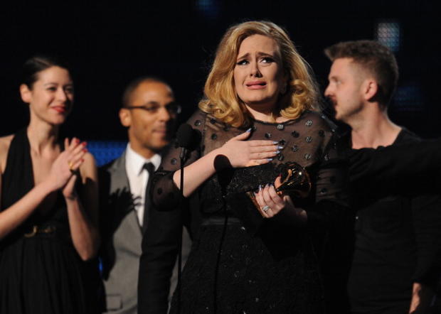 Singer Adele cries as she accepts her Grammy for Album Of The Year. 