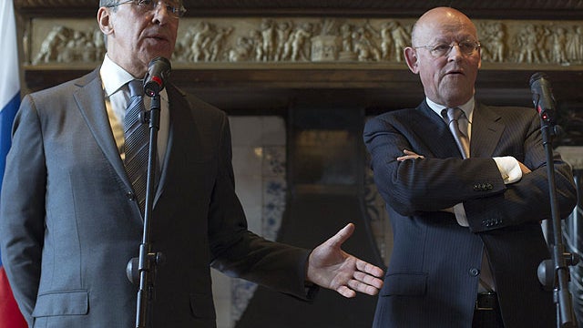 Russian Foreign Minister Sergey Lavrov, left, gestures as he answers questions standing next to Dutch Foreign Minister Uri Rosenthal, right, during a press conference in Wassenaar, near The Hague, Netherlands, Feb. 15, 2012.  