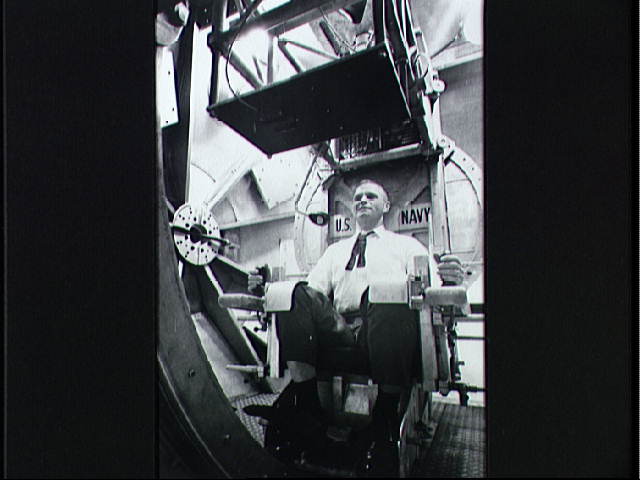Glenn_gets_disorientation_training_-_NASA.jpg
