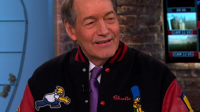 Charlie Rose shows off his "Simpsons" jacket 