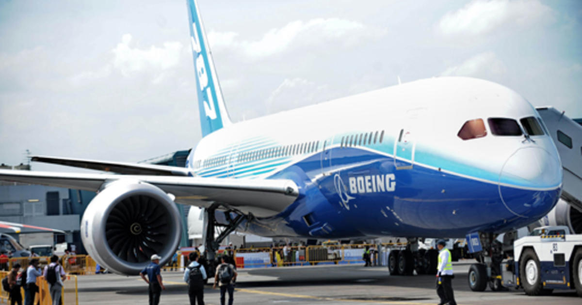 Boeing net income jumps; raises outlook - CBS News