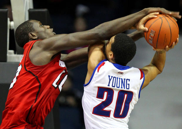 Brandon Young is fouled on the way to the basket 