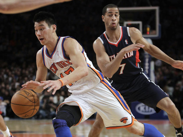 Lin drives toward basket, leaving Atlanta Hawks guard Jannero Pargo behind in Knicks 99-82 victory at Madison Square Garden in New York in February 
