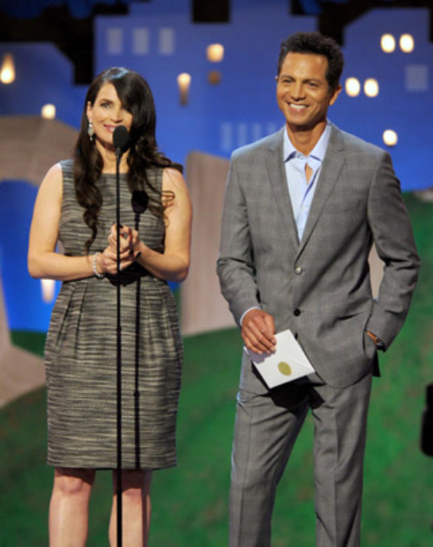 Julia Ormond, left, and Benjamin Bratt present an award onstage at the Independent Spirit Awards 