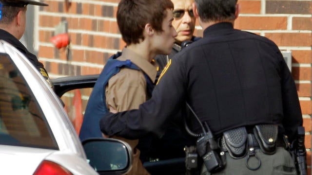 TJ Lane being taken into juvenile court by Geauga County deputies in Chardon, Ohio, Tuesday 