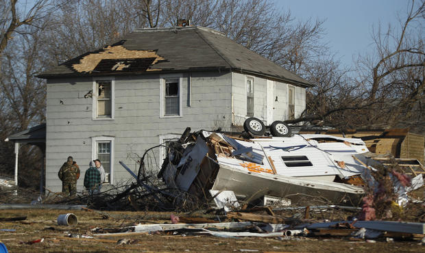 Residents gather the morning after severe storms destroyed several homes 