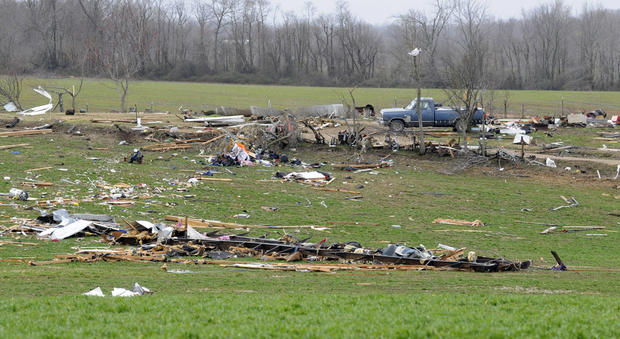 A moblie home destroyed in a field 