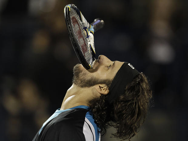 Feliciano Lopez  reacts after he lost a point against Roger Federer 