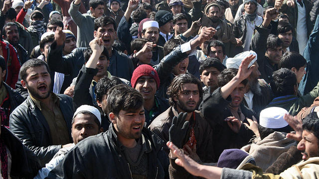 Afghan demonstrators shout anti-U.S. slogans during a protest against Koran desecration in Kunduz, Afghanistan, Feb. 25, 2012. 