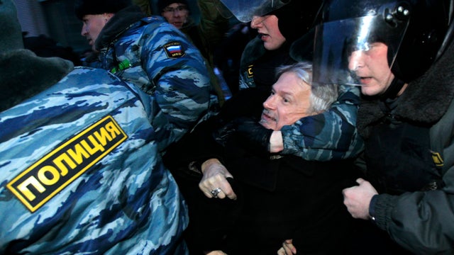 Russian police officers detain opposition leader Edouard Limonov during a protest near the Central Election Committee in Moscow March 5, 2012. 